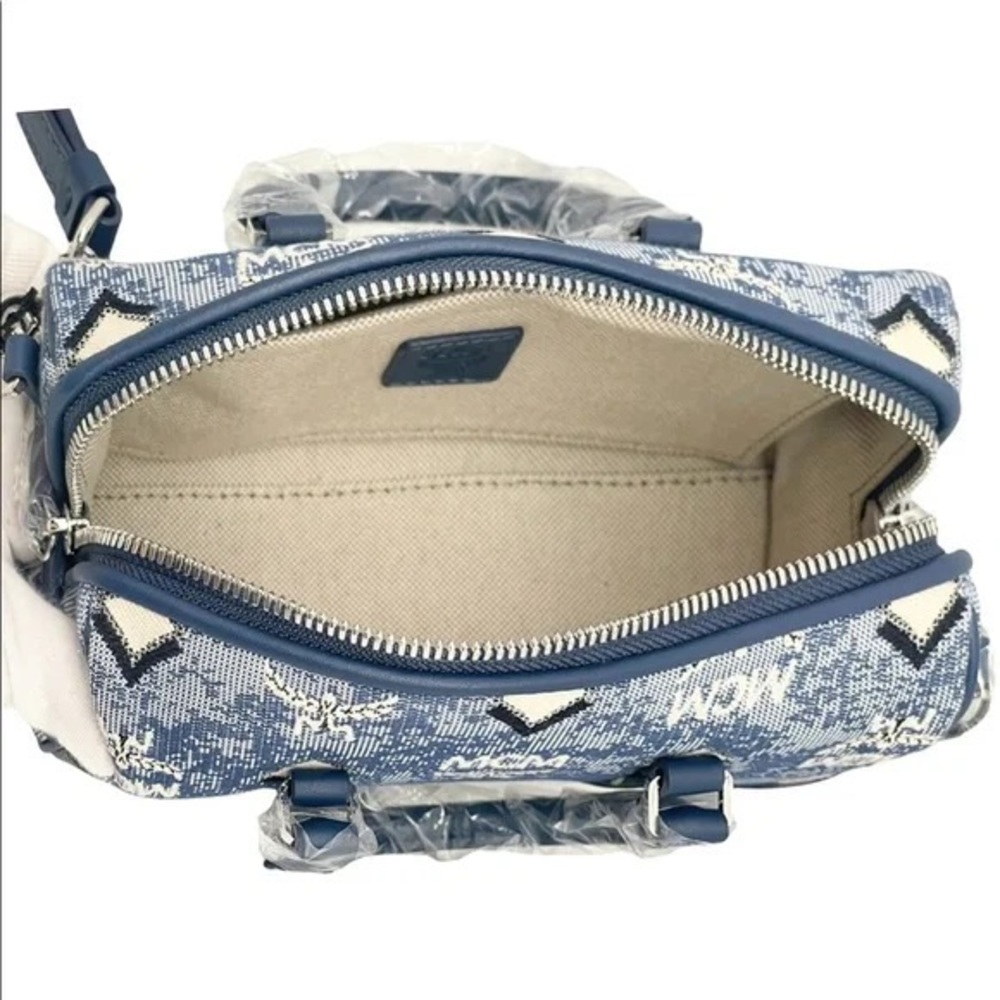 New authentic with tags attached, dust bag and cards and all original packaging